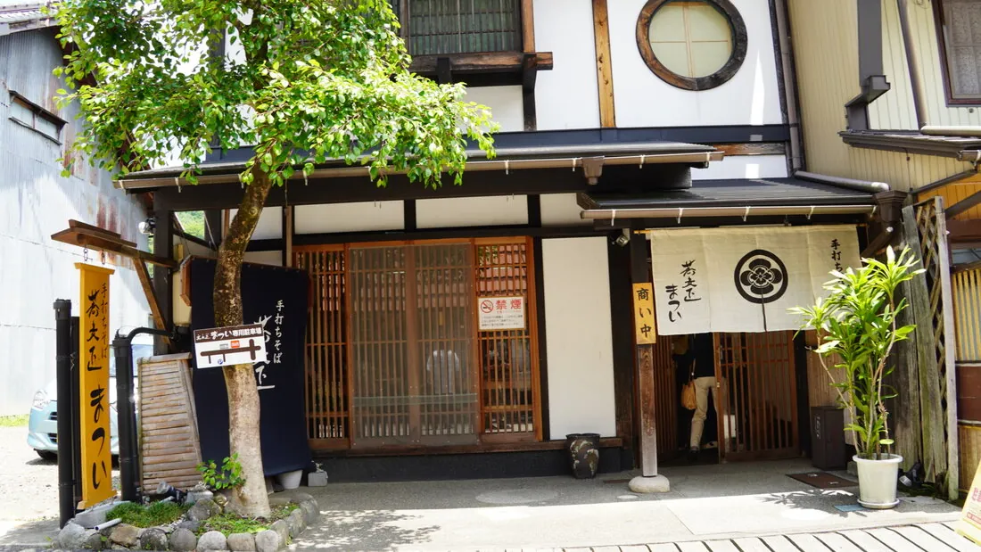 The wooden storefront of Soba Shomatsui in Gujo Hachiman's old craftsmen's quarter